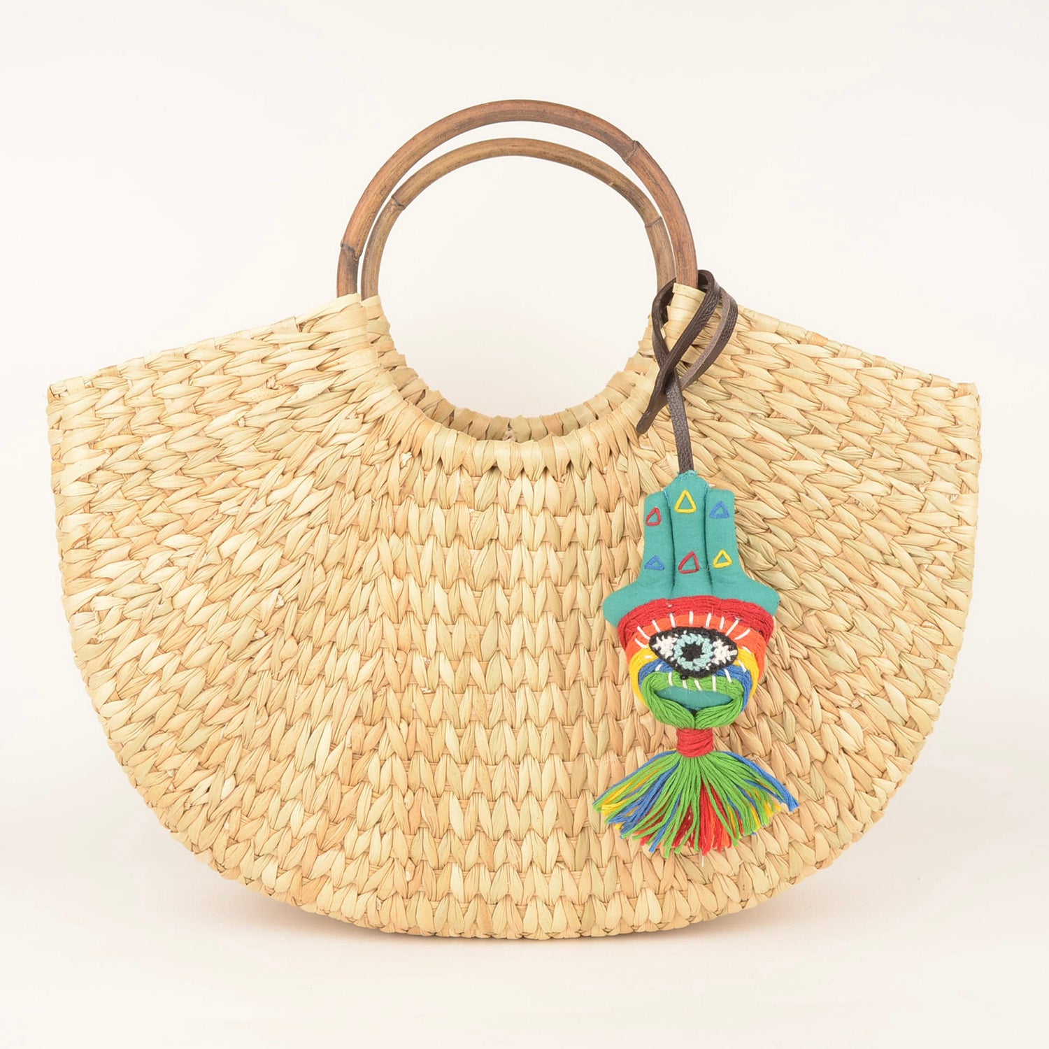 Handcrafted Bag Charm BC_Imaan_01 featuring vibrant waste fabric and a stylish leather strap, made by Hazara artisans.